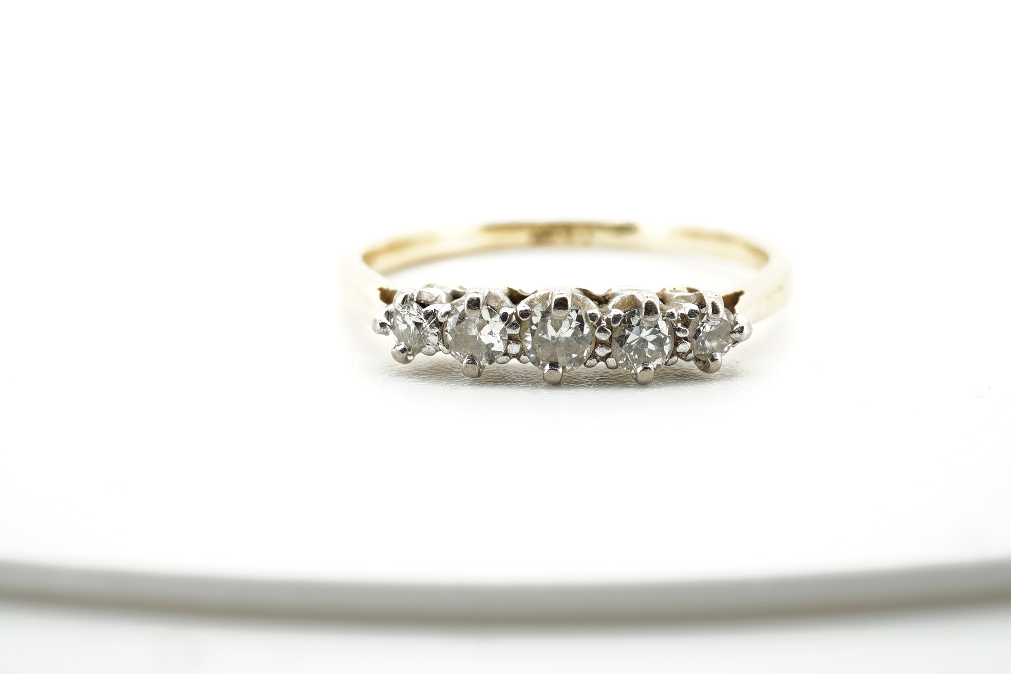 An early 20th century 9ct gold and opal cluster cluster set ring, size M, a 9ct and four(ex five) stone set opal half hoop ring and an 18ct and five stone diamond set half hoop ring. Condition - poor to fair
